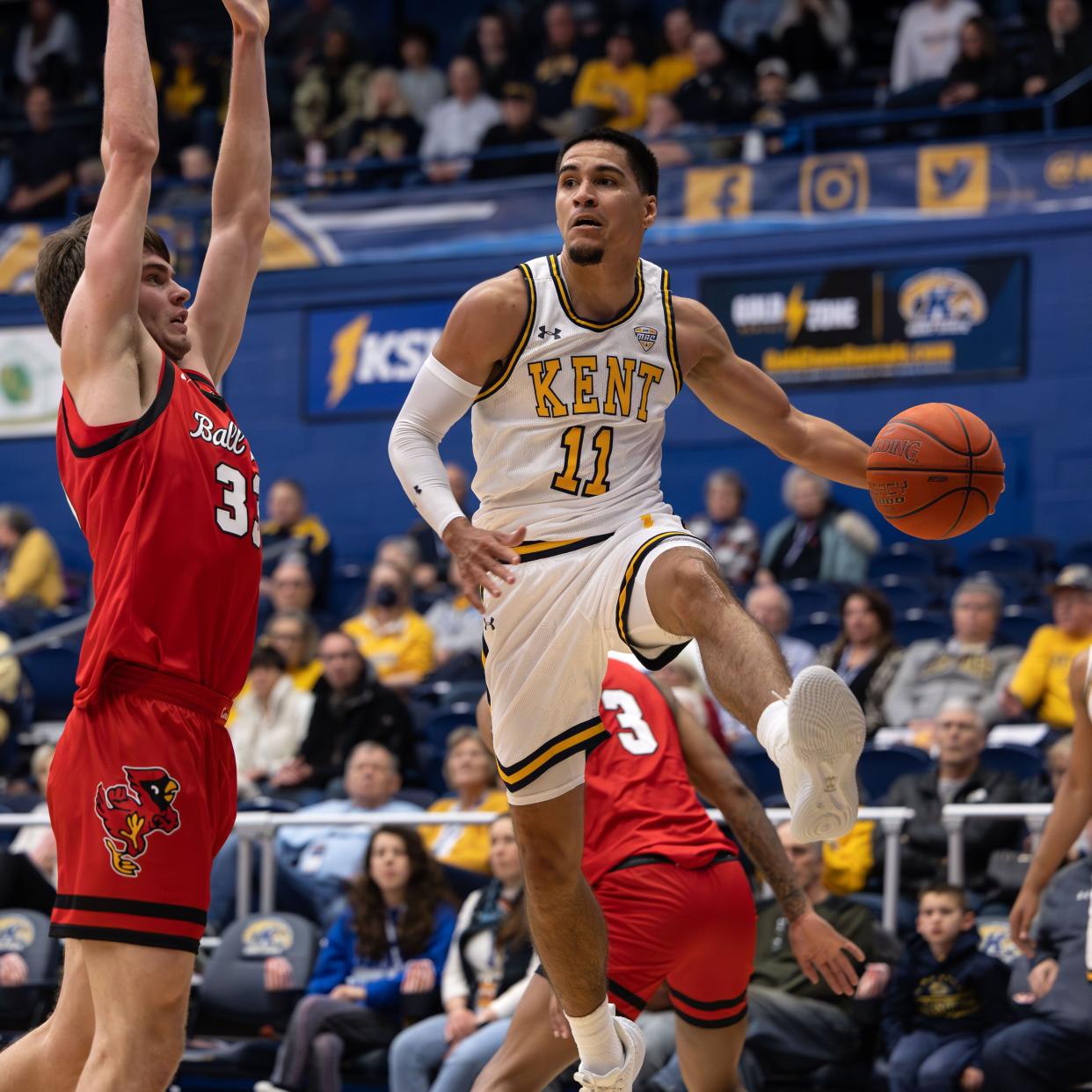 Kent State guard Giovanni Santiago goes up for a leaping pass during the first half against Ball State on Tuesday in Kent. Santiago had a team-best five assists for the Golden Flashes in an 82-69 victory.