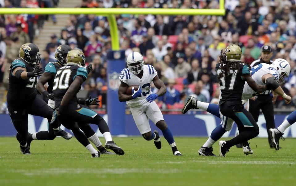 Frank Gore, center, runs against the Jacksonville Jaguars (AP)