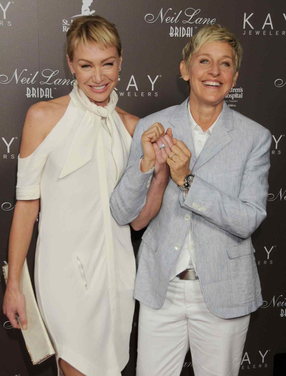 Ellen DeGeneres and Portia de Rossi arrive at jewelry designer Neil Lane's debut of his new Bridal Collection with Kay Jewelers at a star-studded Hollywood launch party at Drai's, The W Hollywood Rooftop on July 22, 2010 in Hollywood, California