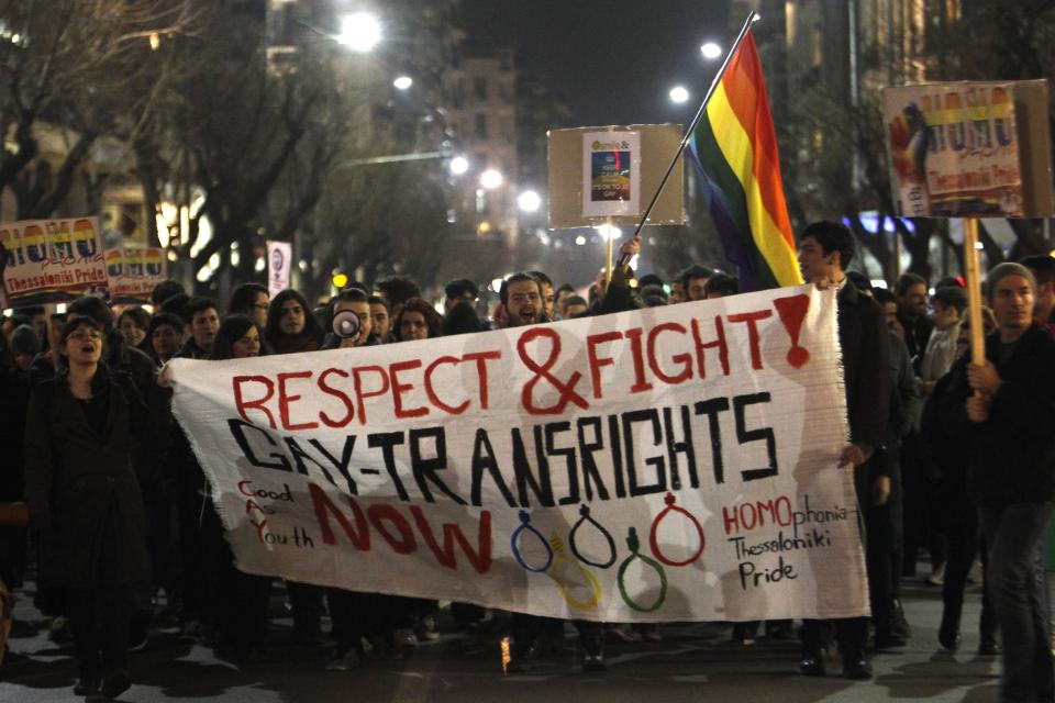 Several hundred gay rights activists march during a protest in the northern Greek port city of Thessaloniki, Greece, Friday, Feb. 7, 2014. The protest was against Russia's anti-gay laws on the same day as the opening ceremony of the Olympic Games in Sochi (AP Photo/Nikolas Giakoumidis)