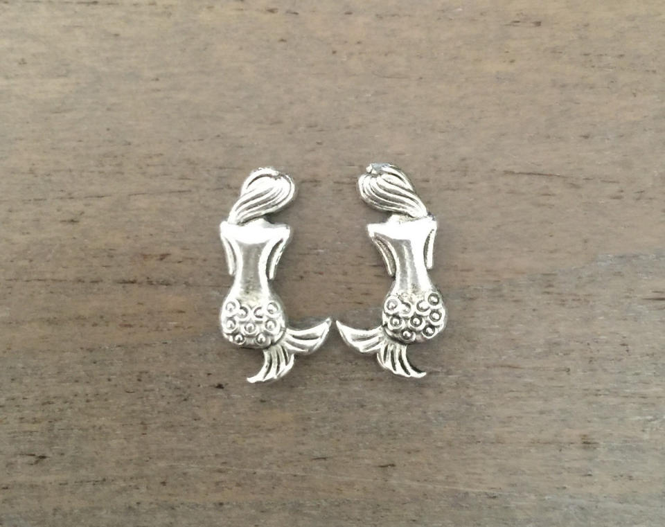 Mermaid Earrings, $14, <a href="https://www.etsy.com/listing/273616114/mermaid-earrings-small-silver-studs?ga_order=most_relevant&amp;ga_search_type=all&amp;ga_view_type=gallery&amp;ga_search_query=mermaid&amp;ref=sr_gallery_44" target="_blank">Etsy</a>