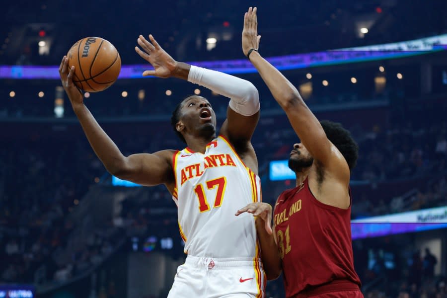 Atlanta Hawks forward Onyeka Okongwu (17) shoots against Cleveland Cavaliers center Jarrett Allen (31) during the first half of an NBA basketball game Saturday, Dec. 16, 2023, in Cleveland. (AP Photo/Ron Schwane)