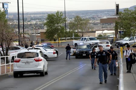 Police are seen after a mass shooting at a Walmart in El Paso