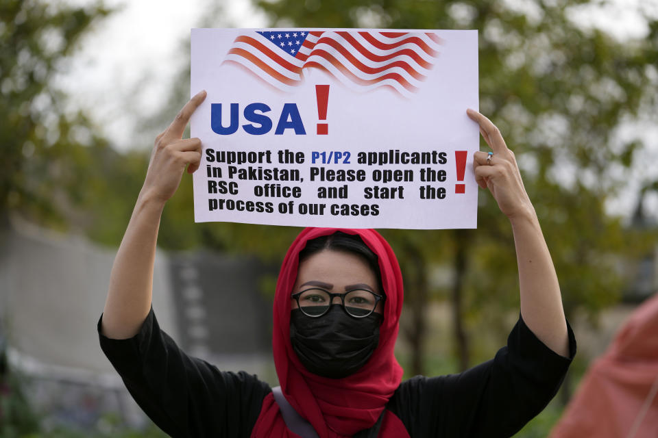 An Afghan refugee attends a rally demanding their U.S. visas to be processed in Islamabad, Pakistan, Sunday, Feb. 26, 2023. When the U.S. pulled out of Afghanistan in August 2021, it carried tens of thousands of Afghans to safety. But two years later, many others are still waiting to be resettled. Those are Afghans who helped the war effort by working with the U.S. government and military or Afghan journalists and aid workers whose former work puts them at risk under the Taliban. (AP Photo/Rahmat Gul, File)