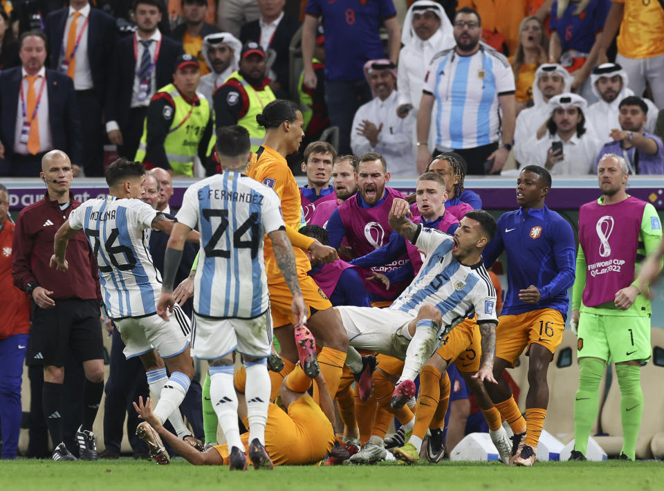 LUSAIL CITY, QATAR - DECEMBER 09: Virgil Van Dijk of Netherlands clashes with Leandro Paredes of Argentina during the FIFA World Cup Qatar 2022 quarter final match between Netherlands and Argentina at Lusail Stadium on December 09, 2022 in Lusail City, Qatar. (Photo by Ian MacNicol/Getty Images)