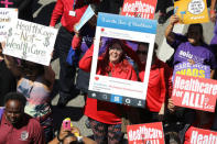 People march in a "Save Obamacare" rally on the seventh anniversary of Obamacare's signing, in Los Angeles, California, U.S. March 23, 2017. REUTERS/Lucy Nicholson