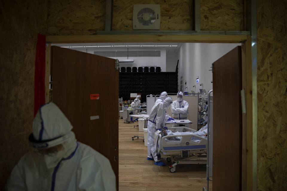 Medical personnel wearing protective equipment treat COVID-19 patients in an intensive care ward for coronavirus patients at Ziv Medical Center in the northern Israeli city of Safed, Sunday, Feb. 7, 2021. (AP Photo/Oded Balilty)