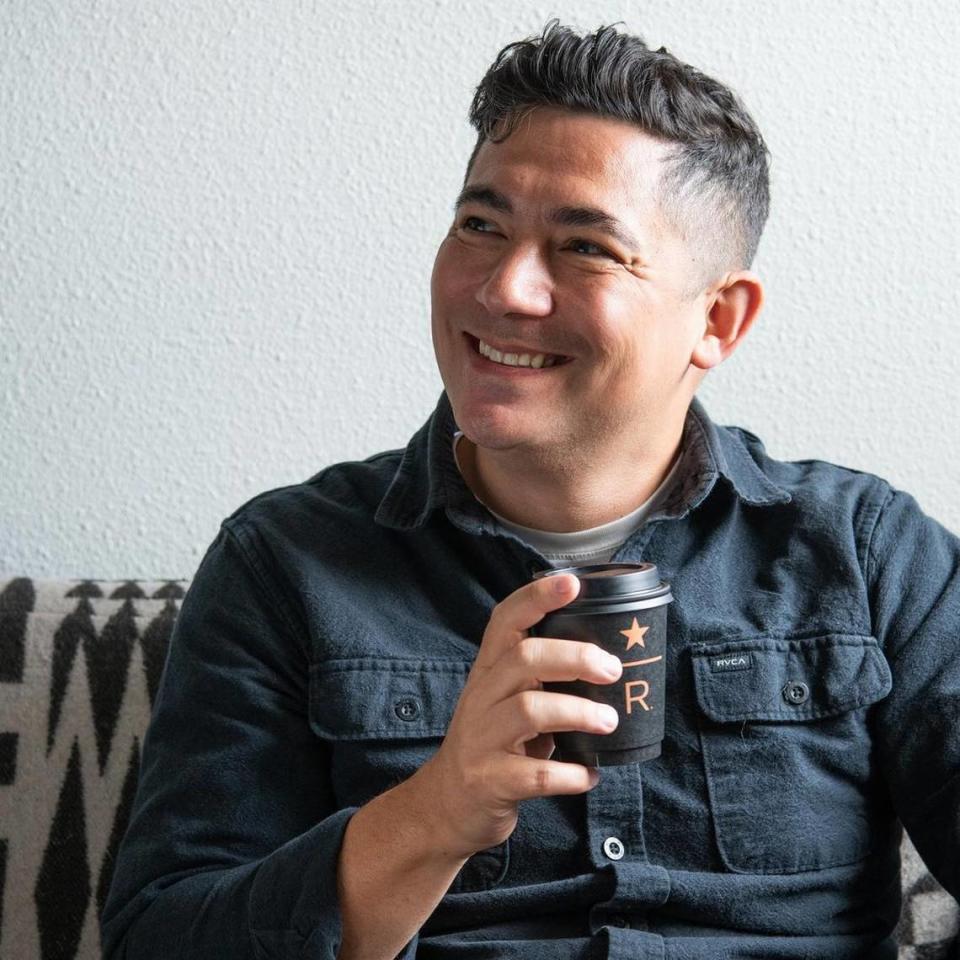 Nooksack artist Louie Gong, founder of Native-owned art and lifestyle brand Eighth Generation, sips from the Coast Salish Pattern tumbler he designed for an exclusive holiday collaboration with Starbucks.