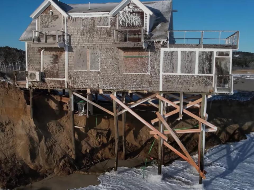 A home on Ballston Beach on Cape Cod was left teetering over the ocean following a severe storm known as a ‘bomb cyclone’ in January (Getty)