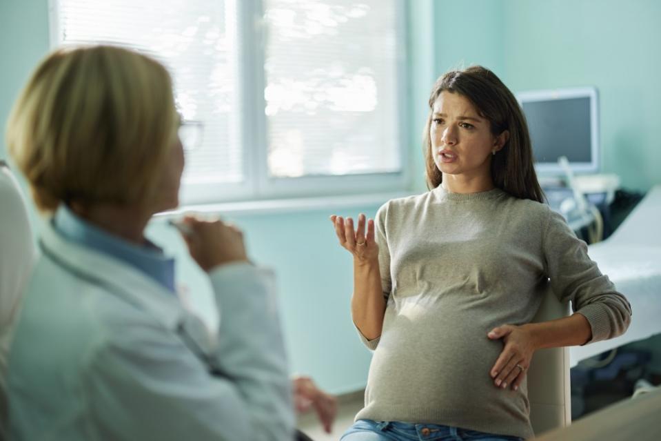 A pregnant mother is going back and forth with her own mom over not allowing her to be present during birth. Getty Images