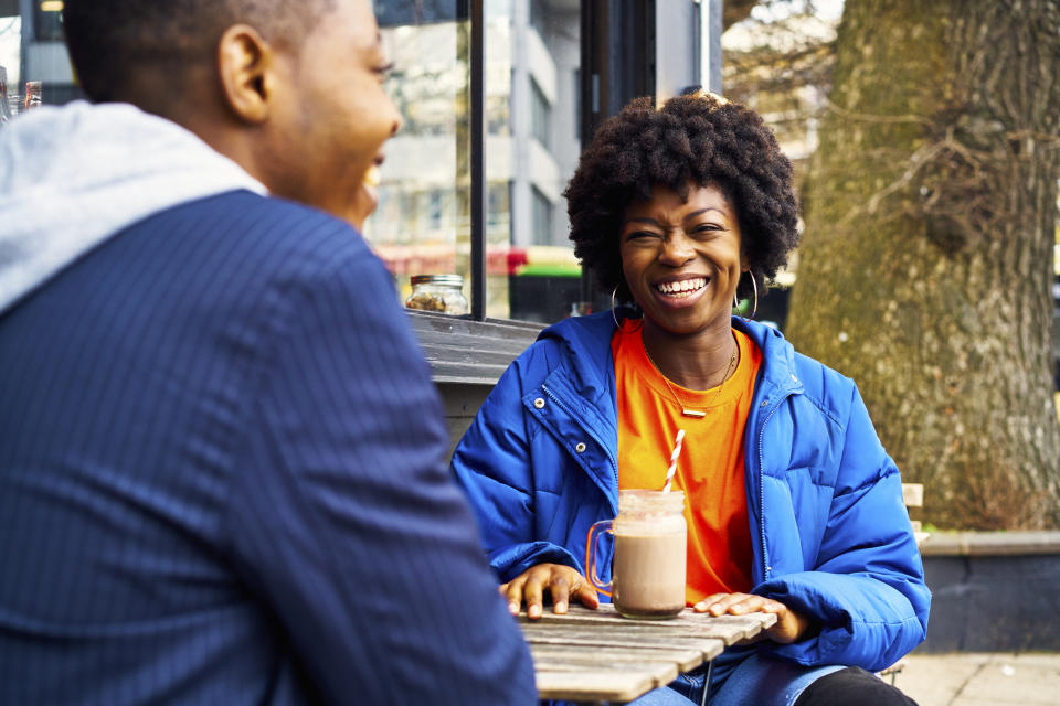 two friends getting coffee talking