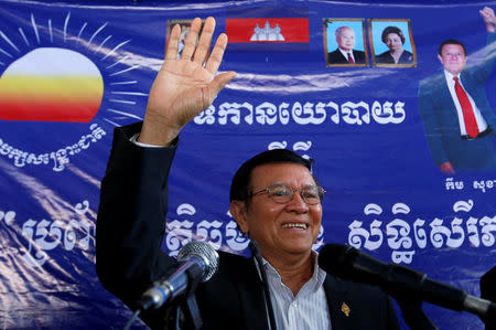 FILE PHOTO - Kem Sokha, leader of the Cambodia National Rescue Party (CNRP), greets his supporters at headquarters before he goes to register for next year's local elections, in Phnom Penh, Cambodia October 5, 2016. REUTERS/Samrang Pring/File Photo