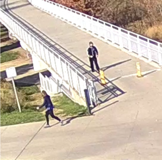 A still from surveillance video released by Council Bluffs Police shows former U.S. Sen. Martha McSally jogging along the River's Edge Trail. Police say the man in the hoodie, believed to be Dominic Henton, was following her and later assaulted her.