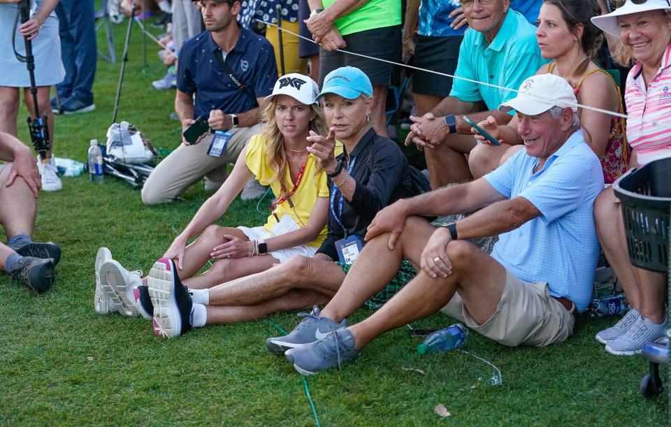 Eric Cole’s mother, former LPGA professional Laura Baugh (center) watches her son on the 18th hole during the final round of the Honda Classic at PGA National Resort & Spa on Sunday, February 26, 2023, in Palm Beach Gardens, FL.
