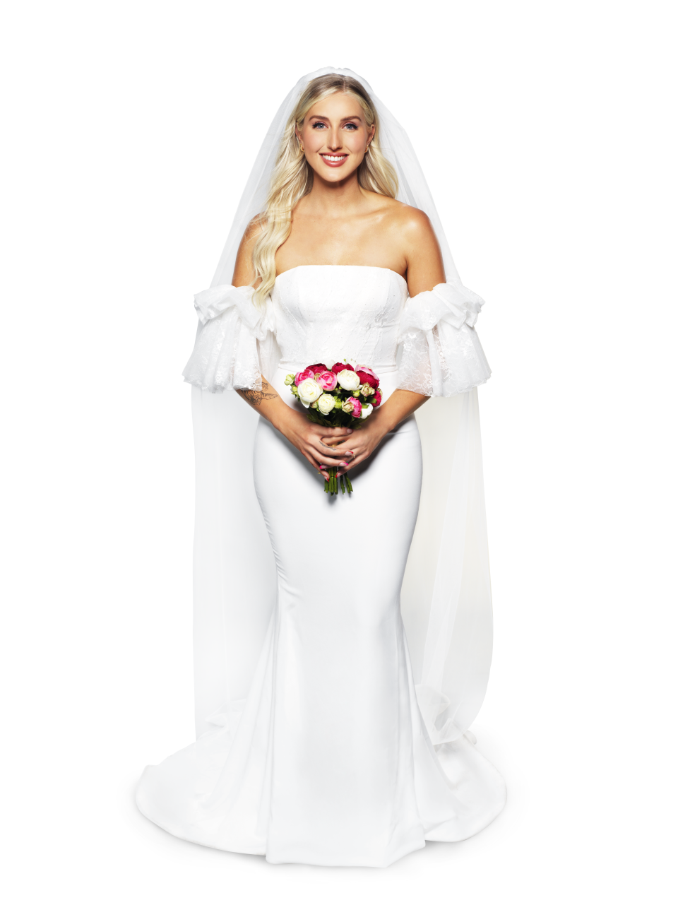 Married At First Sight Australia 2022 Bride Samantha wears a strapless gown with off-the-shoulder sleeve and train and veil, carries pink and white roses, and wears her long curly blonde hair loose.