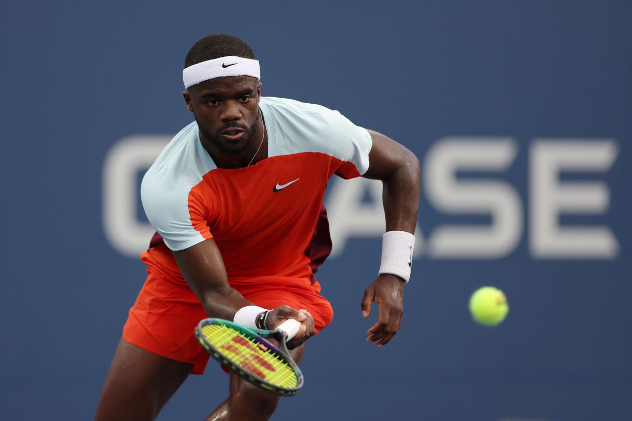 Frances Tiafoe of the United States returns a shot against Marcos Giron of the United States in their Men's Singles First Round match on Day Two of the 2022 U.S. Open at USTA Billie Jean King National Tennis Center on Aug. 30, 2022, in Flushing, Queens.