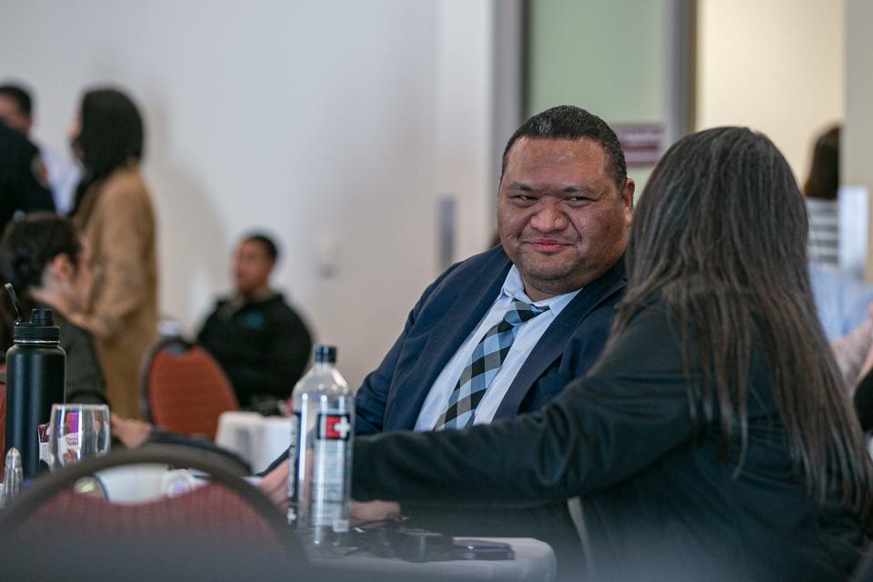 Ifo Pili, Las Cruces city manager, chats with another city staffer during the budget retreat on Feb. 22, 2023.