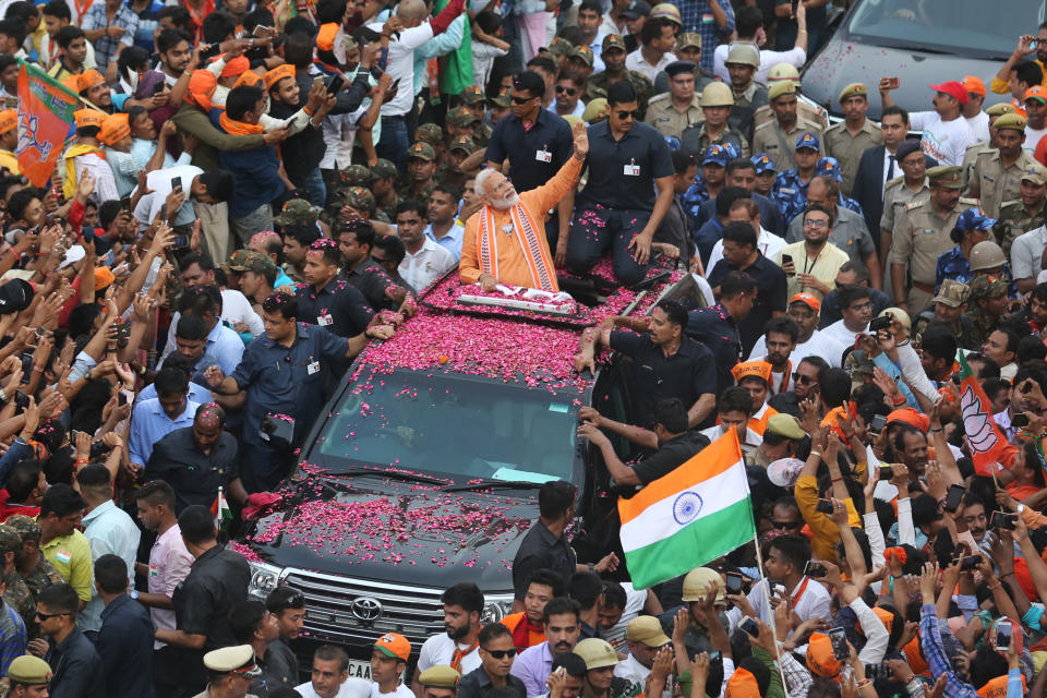 FILE - Indian Prime Minister Narendra Modi waves to a crowd while campaigning in Varanasi, India, April 25, 2019. (AP Photo/Rajesh Kumar Singh, file)