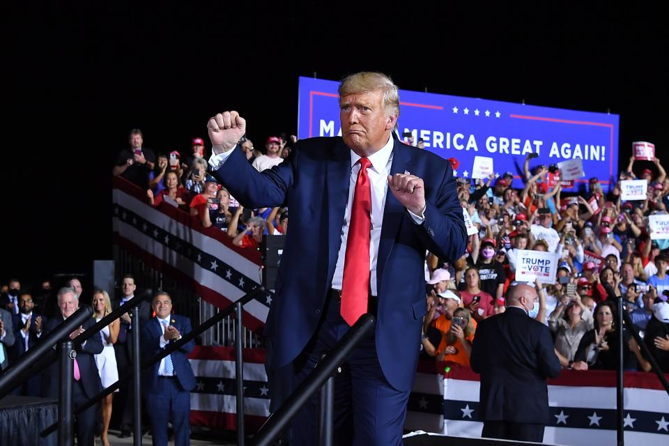 TOPSHOT - US President Donald Trump dances at the end of a campaign rally at Pensacola International Airport in Pensacola, Florida on October 23, 2020. (Photo by MANDEL NGAN / AFP) (Photo by MANDEL NGAN/AFP via Getty Images)