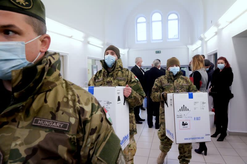 FILE PHOTO: Hungarian soldiers carry the first shipment of Pfizer-BioNTech coronavirus disease (COVID-19) vaccines at the Del-Pest Central Hospital in Budapest