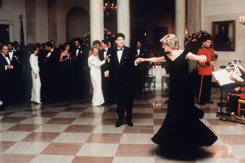 Diana, Princess Of Wales dancing with John Travolta at the White House, Washington, on Nov. 9, 1985. The princess wore a midnight blue velvet dress by fashion designer Victor Edelstein, as President Ronald and Mrs Nancy Reagan watched on<span class="copyright">Tim Graham Photo Library via Getty Images</span>