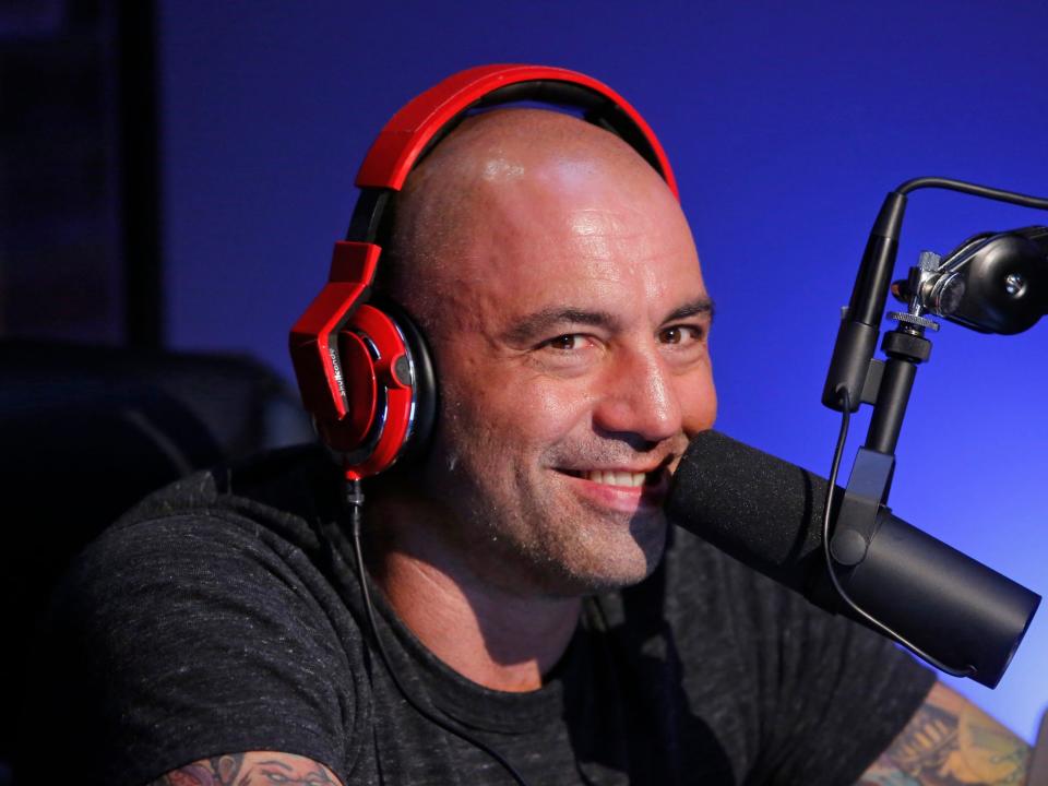 Joe Rogan speaking into a mic.