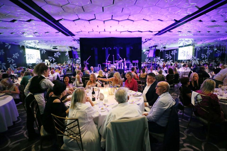 people sitting in a ballroom