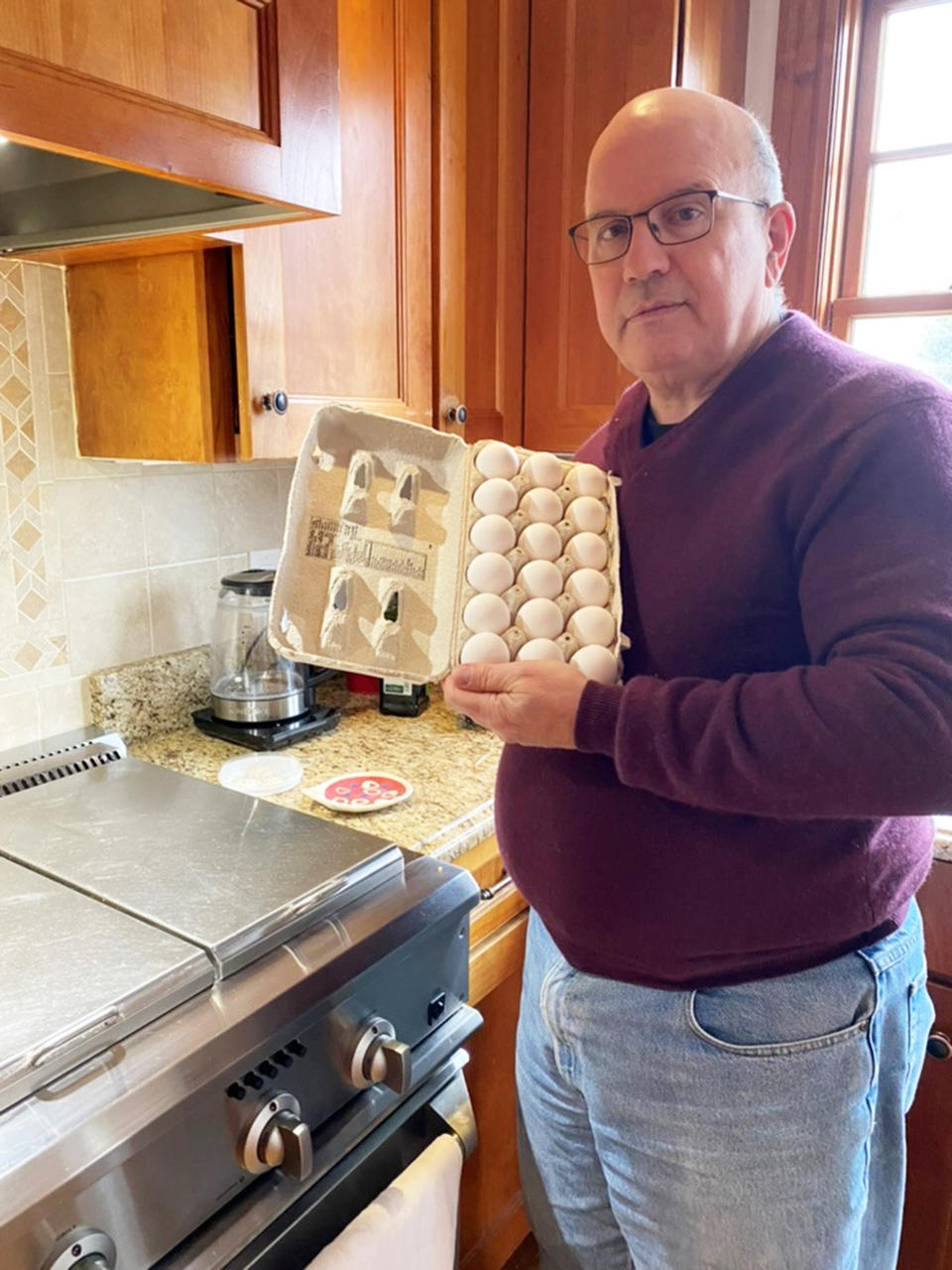 My dad, Richard, and his beloved eggs, which he uses almost exclusively for omelets. (Courtesy Lizzie Stark)