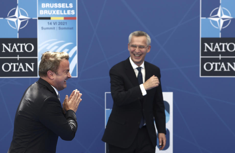 NATO Secretary General Jens Stoltenberg greets Luxembourg's Prime Minister Xavier Bettel during arrivals for a NATO summit at NATO headquarters in Brussels, Monday, June 14, 2021. U.S. President Joe Biden is taking part in his first NATO summit, where the 30-nation alliance hopes to reaffirm its unity and discuss increasingly tense relations with China and Russia, as the organization pulls its troops out after 18 years in Afghanistan. (Kenzo Tribouillard, Pool via AP)