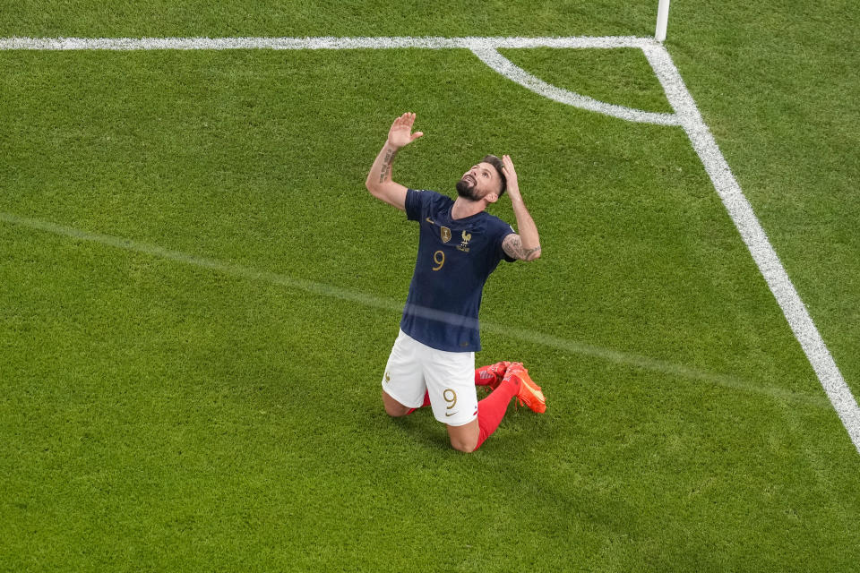 France's Olivier Giroud celebrates after scoring his side's opening goal during the World Cup round of 16 soccer match between France and Poland, at the Al Thumama Stadium in Doha, Qatar, Sunday, Dec. 4, 2022. (AP Photo/Thanassis Stavrakis)