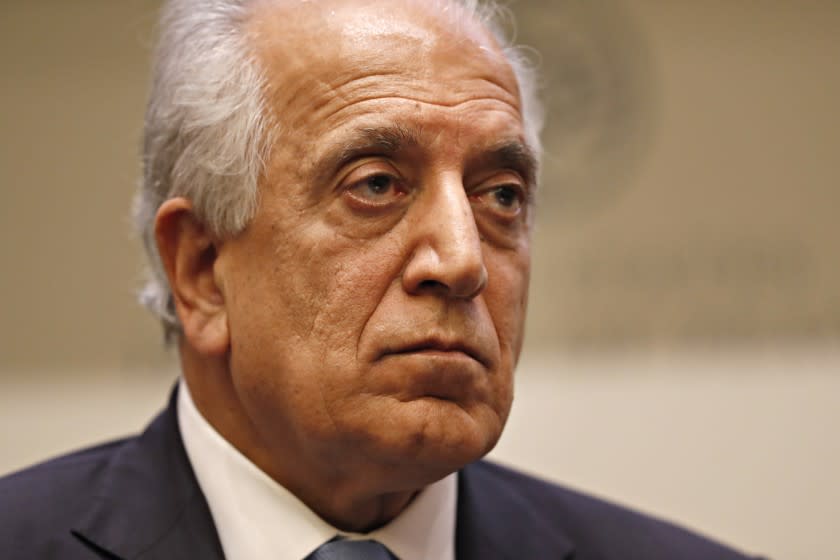 FILE - In this Feb. 8, 2019, file photo, Special Representative for Afghanistan Reconciliation Zalmay Khalilzad pauses while speaking about the prospects for peace, at the U.S. Institute of Peace, in Washington. Afghanistan's former deputy minister says Khalilzad is in the Afghan capital "to discuss the latest in peace efforts." Former deputy foreign minister Hekmat Karzai tweeted pictures of his meeting with Khalilzad Wednesday, Dec. 4, 2019, saying 'we spoke about the way forward." (AP Photo/Jacquelyn Martin, File)