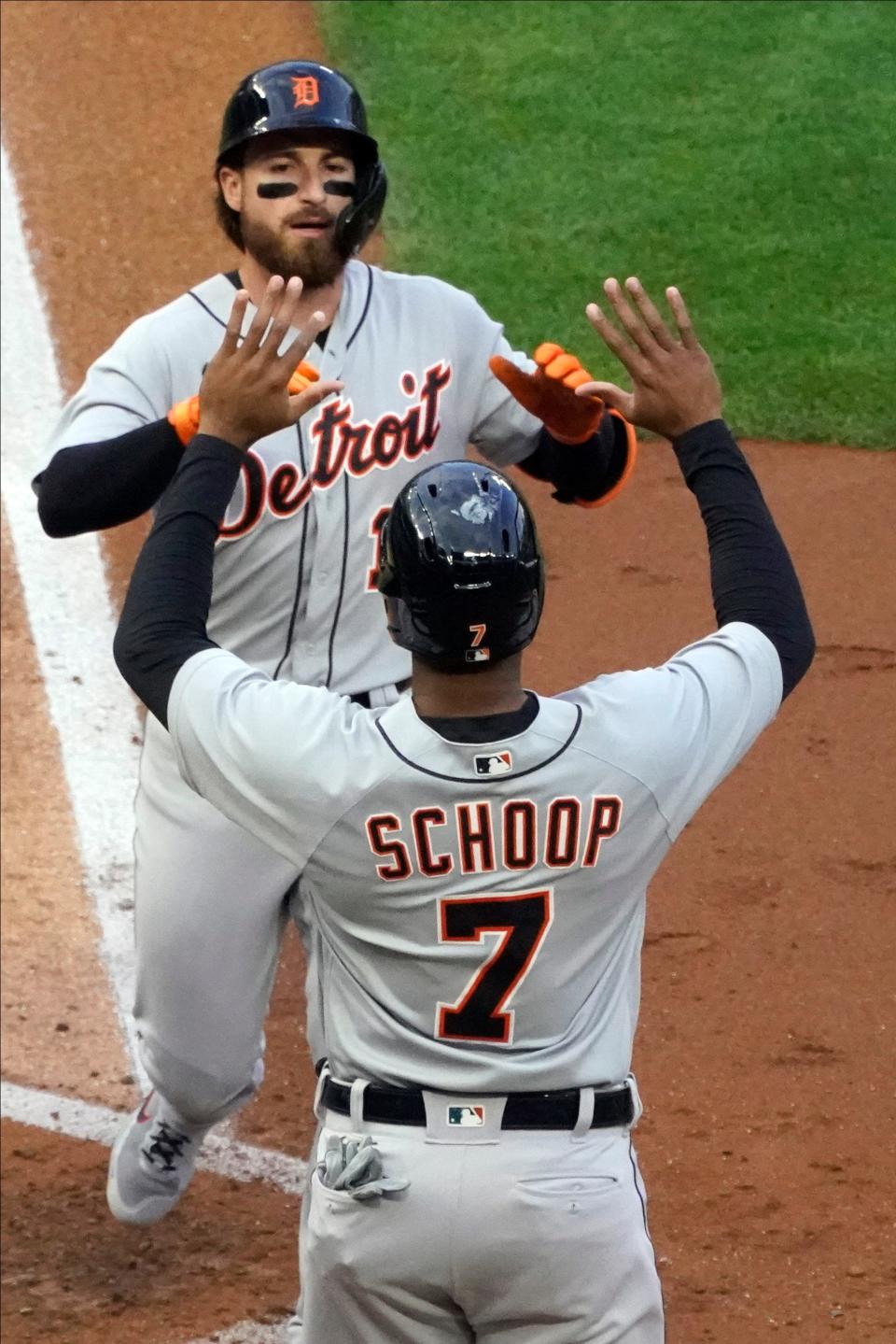 Detroit Tigers Eric Haase, rear, and Jonathan Schoop celebrates Haase's two-run home run off Minnesota Twins pitcher J.A. Happ during the fourth inning of a baseball game Thursday, July 8, 2021, in Minneapolis.