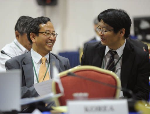 Japan's Commissioner Kenji Kgawa (R) speaks with South Korea's Commissioner Joon-Suk Kang during the 64th Annual meeting of the International Whaling Commission in Panama City. Japan kills hundreds of whales each year using a loophole that allows lethal research on the ocean giants, with the meat then going for consumption. South Korea told the commission it would follow suit