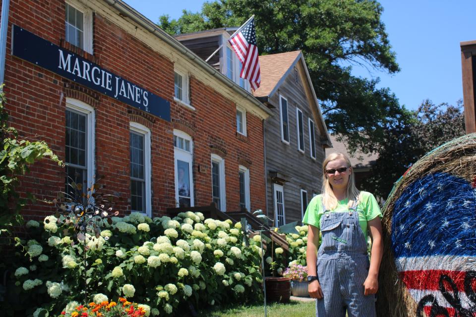 Megan Cronbaugh works at Margie Jane's, a retail store located at 4550 220th Trail in Amana, with father and owner Aaron Cronbaugh, June 27.