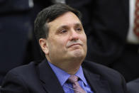 FILE - In this Feb. 11, 2015, file photo outgoing Ebola czar Ron Klain listens as President Barack Obama speaks about the Ebola outbreak response by the U.S. in West Africa in the South Court Auditorium of the White House complex in Washington. Klain is preparing to serve as President-elect Joe Biden’s chief of staff, a job often referred to as the nation’s chief operating officer. (AP Photo/Jacquelyn Martin, File)