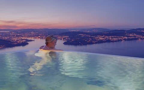 The Bürgenstock Hotel's heated outdoor infinity pool, seemingly dripping into Lake Lucerne
