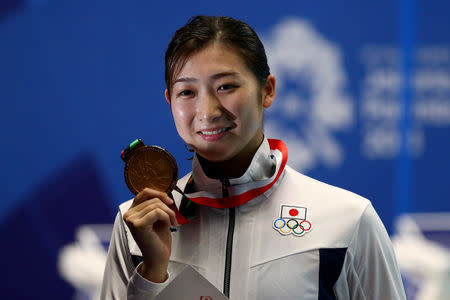 FILE PHOTO : 2018 Asian Games - Swimming - Women's 100m Freestyle Final - GBK Aquatic Center, Jakarta, Indonesia - August 20, 2018 Gold medalist Rikako Ikee of Japan during the medal ceremony REUTERS/Athit Perawongmetha/File Photo