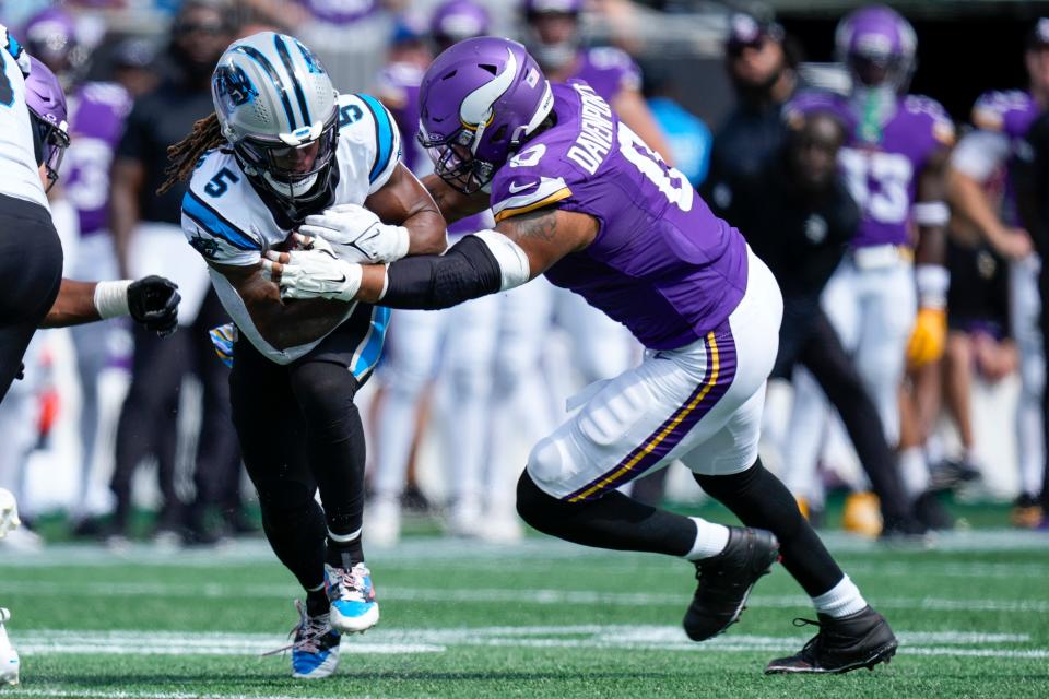 Carolina Panthers receiver Laviska Shenault Jr. is tackled by Minnesota Vikings linebacker Marcus Davenport during the second half at Bank of America Stadium, Oct. 1, 2023 in Charlotte, N.C.