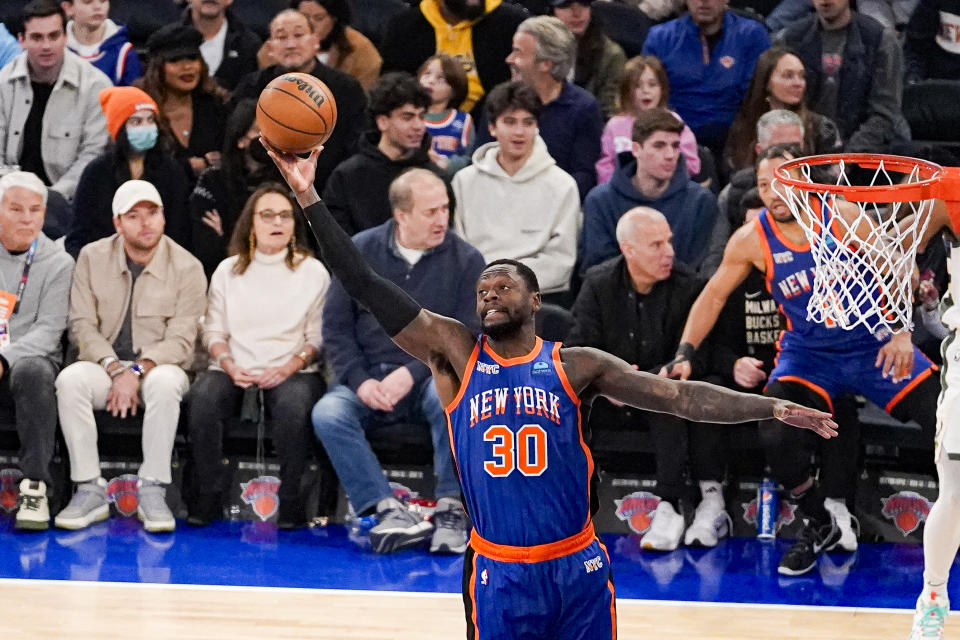 New York Knicks forward Julius Randle (30) grabs a rebound during the first half of an NBA basketball game against the Milwaukee Bucks in New York, Saturday, Dec. 23, 2023. (AP Photo/Peter K. Afriyie)