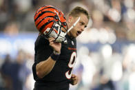 Cincinnati Bengals quarterback Joe Burrow (9) celebrates a two point conversion during the second half of an NFL football game against he Dallas Cowboys Sunday, Sept. 18, 2022, in Arlington, Tx. (AP Photo/Tony Gutierrez)