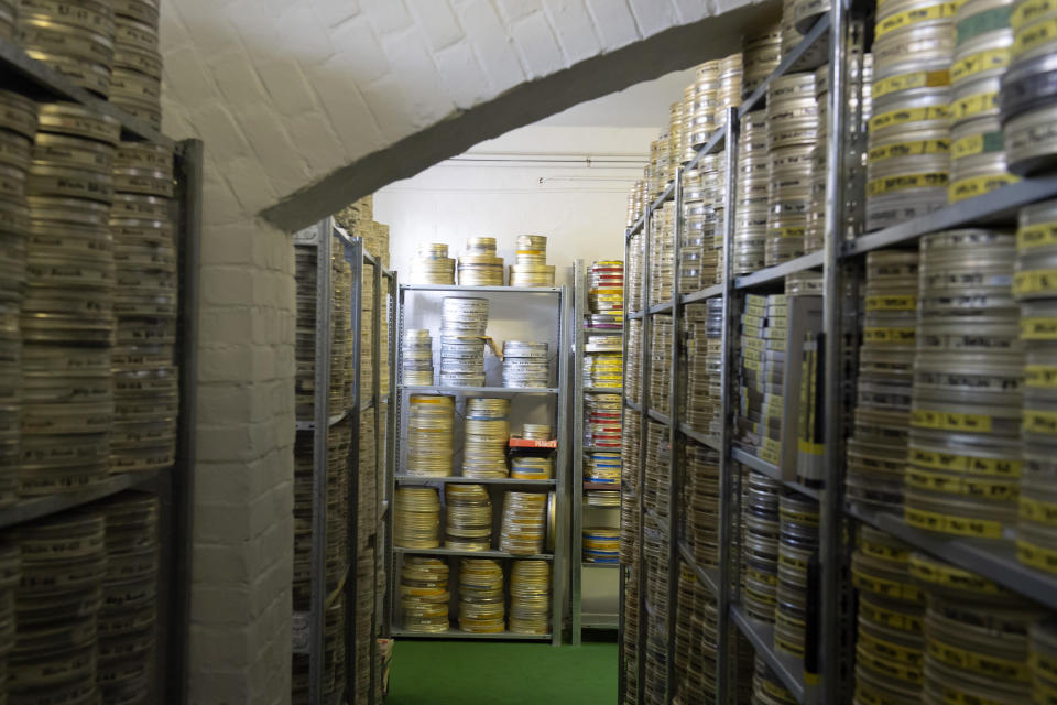 In this Wednesday, June 17, 2020 photo, reels of film are stacked in the archive of PROGRESS Film, in Leipzig, Germany. A new project is underway to digitize thousands of East German newsreels, documentaries and feature films 30 years after Germany’s reunification. The movies that are being scanned, transcribed and posted online provide a look inside a country that no longer exists but was a critical part of the Cold War. (AP Photo/Jens Meyer)