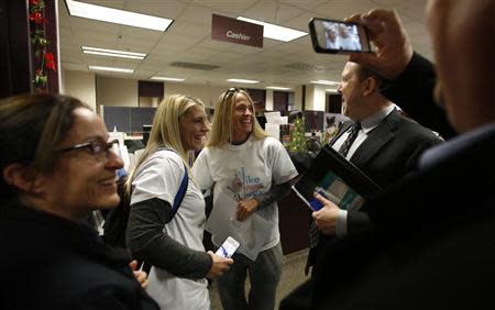 Lindi Gardiner (L) and her partner Joanna Barney get married at the Salt Lake County Clerks office in Salt Lake City, Utah, December 20, 2013. REUTERS/Jim Urquhart