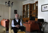 Ramy Finge, a dentist spent two years braving tear gas and rubber bullets during anti-government protests, is one of 13 independent newcomers who won a seat in the latest parliamentary elections, speaks during an interview with The Associated Press, at his home in Tripoli, north Lebanon, Tuesday, May 24, 2022. The strong showing by civil society activists has restored some hope among Lebanese that change is possible. But the reform movement is fragmented and the challenges it faces in fighting an entrenched, sectarian-based ruling clique are enormous. (AP Photo/Hussein Malla)