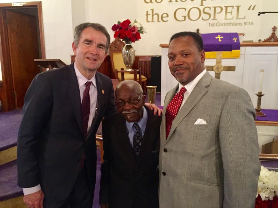 Gov. Ralph Northam, left, is pictured with church deacon Charles Bell, center, and Pastor the Rev. Kelvin F. Jones after the Rev. Dr. Martin Luther King  celebration service at First Baptist Church in Capeville.