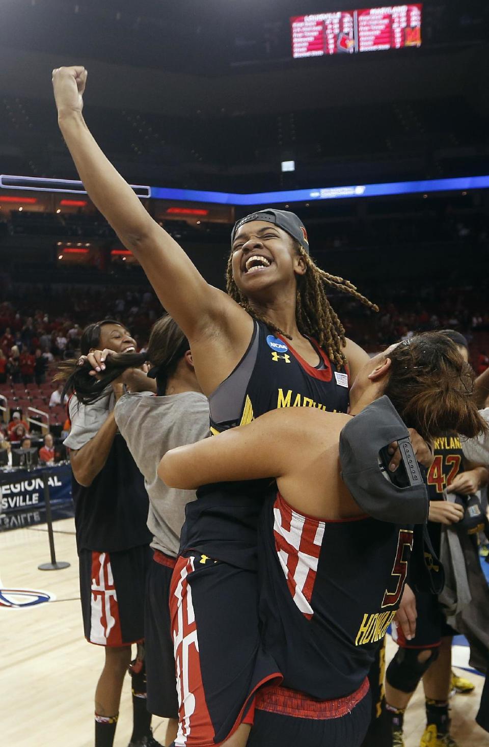 Maryland guard Sequoia Austin celebrates after Maryland defeated Louisville 76-73 in a regional final of the NCAA women's college basketball tournament Tuesday, April 1, 2014, in Louisville, Ky. (AP Photo/John Bazemore)