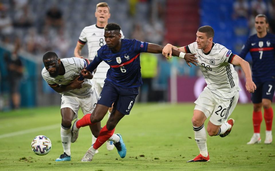 Paul Pogba holds off Germany players - REUTERS