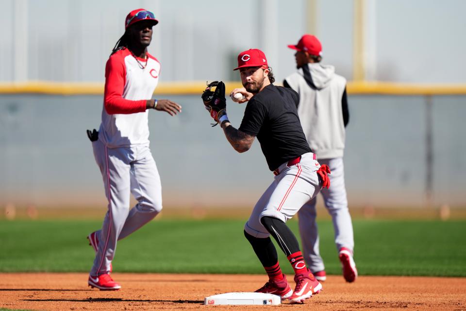 Cincinnati Reds second baseman Jonathan India (6) throws to first base during fielding drills during spring training workouts, Tuesday, Feb. 20, 2024, at the teamÕs spring training facility in Goodyear, Ariz.