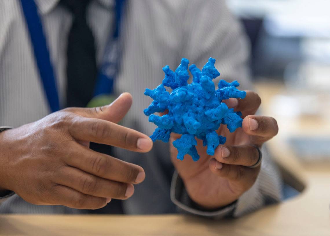 Kevin O. Saunders, PhD, Director of Research for the Duke Human Vaccine Institute, uses a model of the SARS-CoV-2 virus to explain how his department is working on vaccines during an interview in his office at the Duke University Human Vaccine Institute on Wednesday, July 13, 2022 in Durham, N.C.