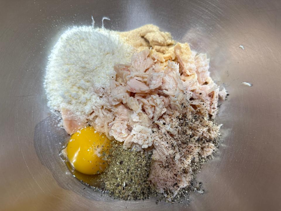 Bowl with canned chicken, egg, grated parm, oregano