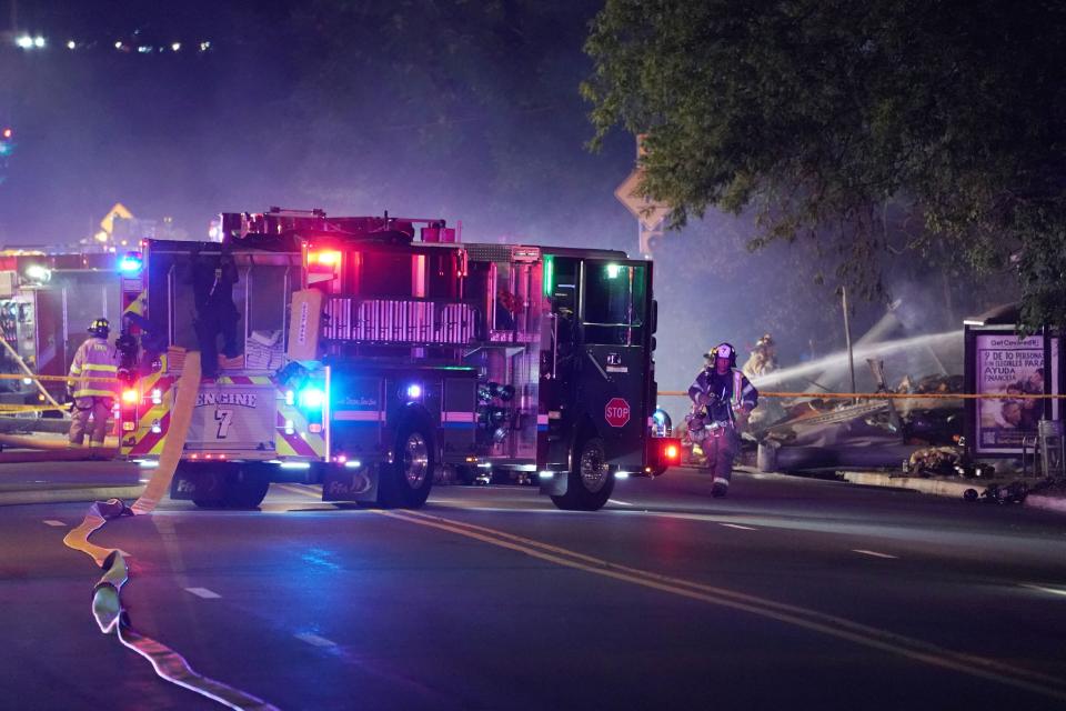 Firefighters at scene of a fiery clash that occurred Saturday night in Elmwood Park on Route 80. A tractor trailer had truck plummeted off the Route 80 exit 61 ramp and burst into flames.